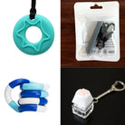 A collage of sensory tools: the 2 Chew Necklaces + 2 Fidget Toys Bundle, featuring a turquoise star-shaped chew pendant, a black sensory necklace in packaging, a blue and white bendable fidget toy, and a white paw keyboard fidget keychain on a clear base.