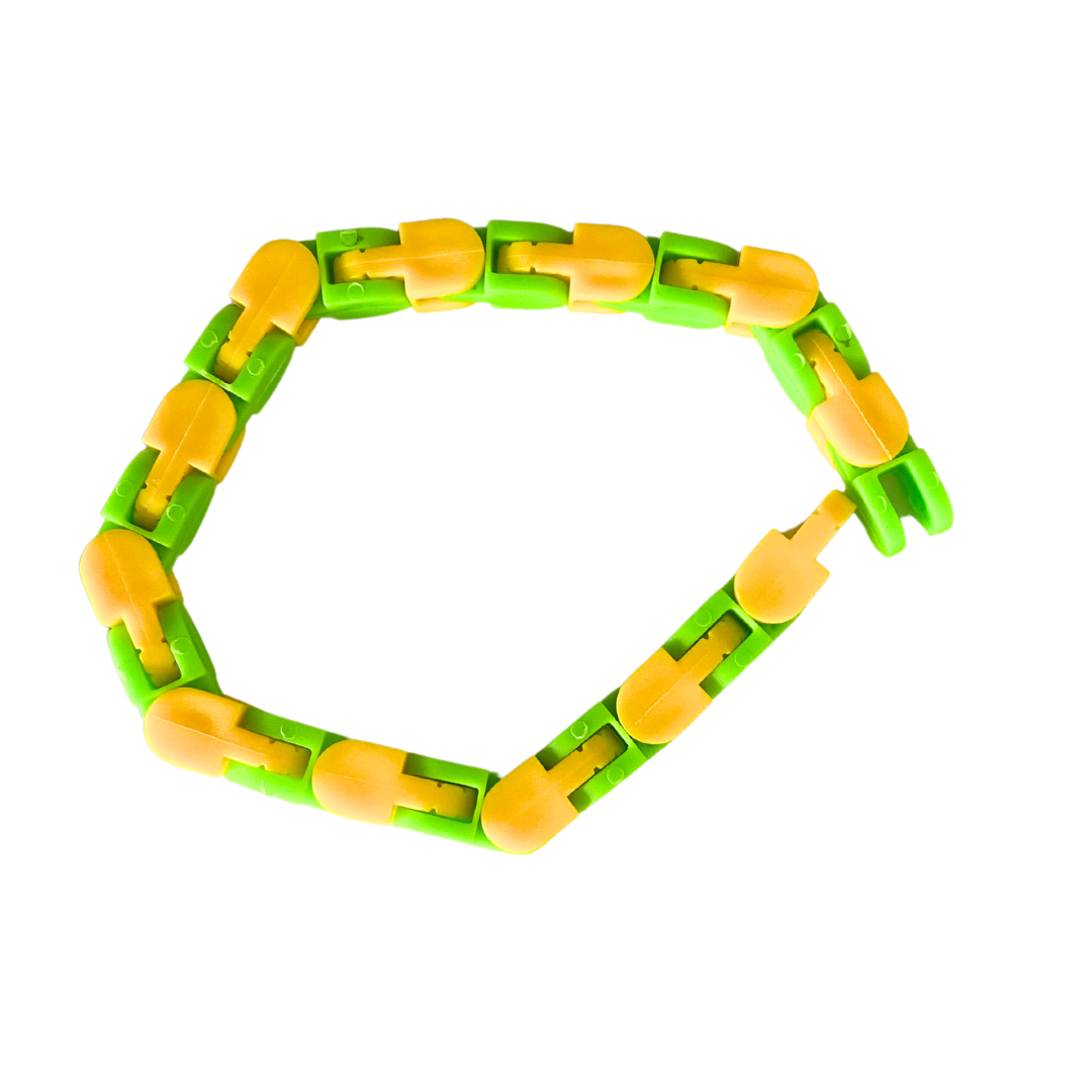 The Snap and Click Fidget Toy, composed of alternating yellow and green segments, forms a loose, flexible loop. The segments are designed to bend and twist freely. The toy is photographed against a white background.